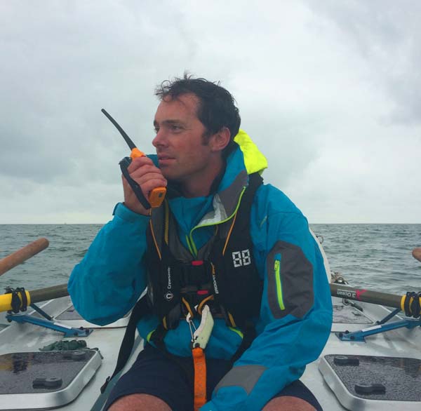 Carbon Zerow Kyle Smith with Ocean Signal V100 VHF handheld radio